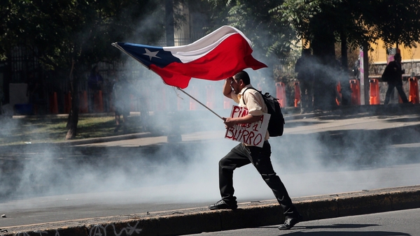 The announcement of a cabinet reshuffle came amid fresh protests outside the presidential palace in central Santiago