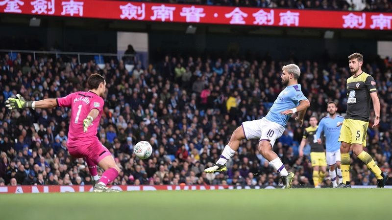 Aguero brace eases holders City into last eight