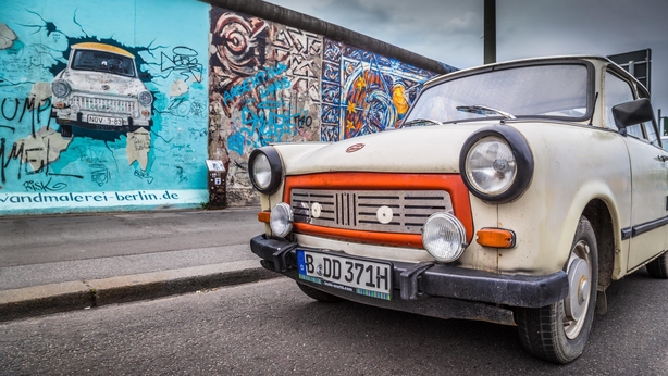 A Trabant car by the Berlin Wall (iStock/PA)