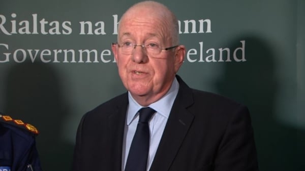 Charlie Flanagan said there were too many people in direct provision 'for too long a time'