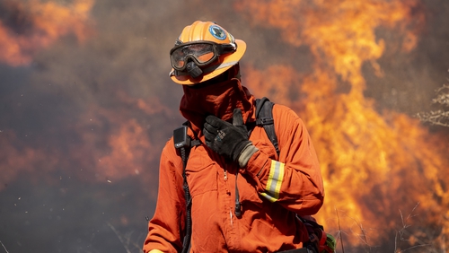 A firefighter near the Ronald Reagan Library as the blaze spreads near Simi Valley, North of Los Angeles