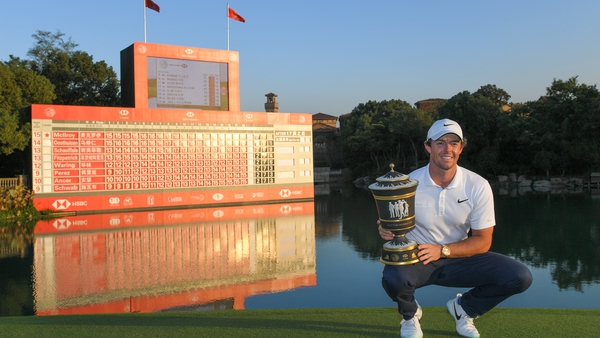 Rory McIlroy poses with the trophy