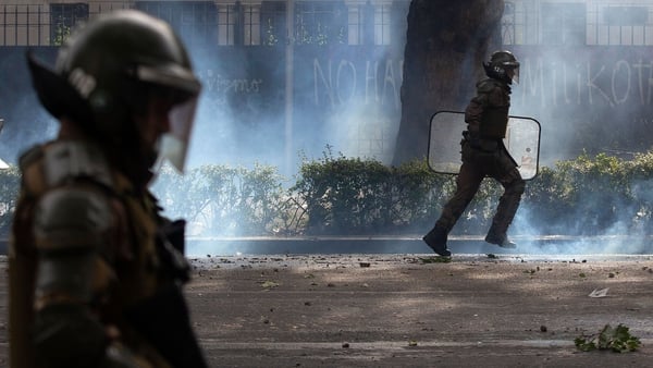 Police in Santiago were dispersing protesters when the quake hit
