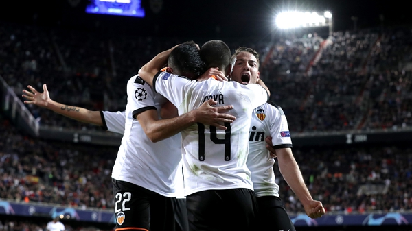 Maximiliano Gomez, Jose Luis Gaya and Manu Vallejo celebrate Valencia's second goal