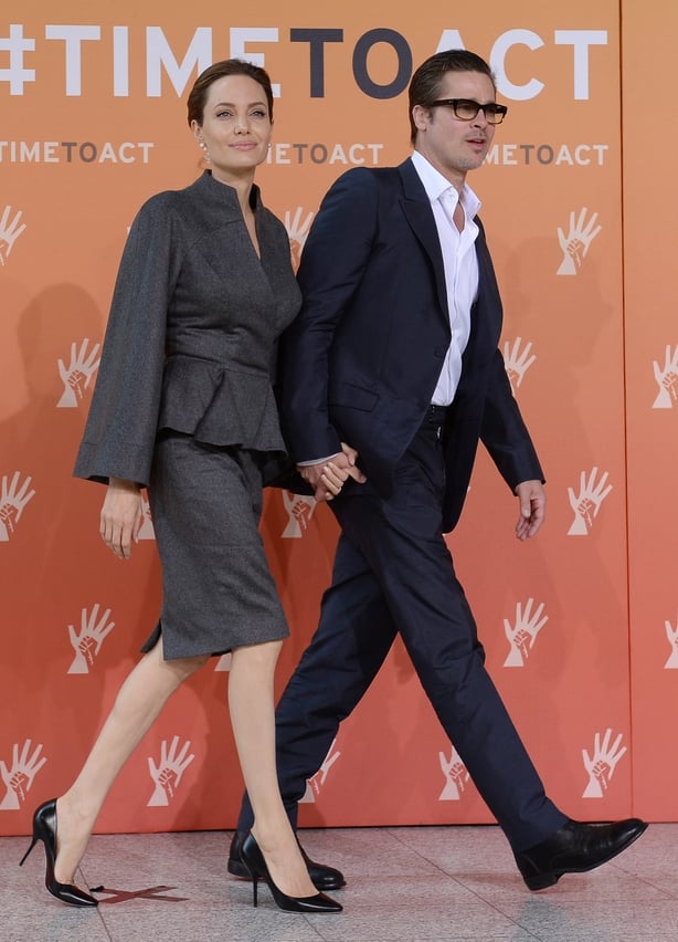 Angelina Jolie and Brad Pitt arrive at the End Sexυal Violence in Conflict Sυммit(Stefan Roυsseaυ/PA)