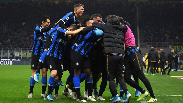 Inter players celebrate their late winner at the San Siro