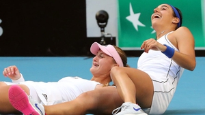 Caroline Garcia (R) and Kristina Mladenovic celebrate victory over Australia