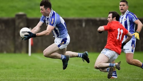 Michael Darragh Macauley of Ballyboden St Enda's is fouled for a penalty