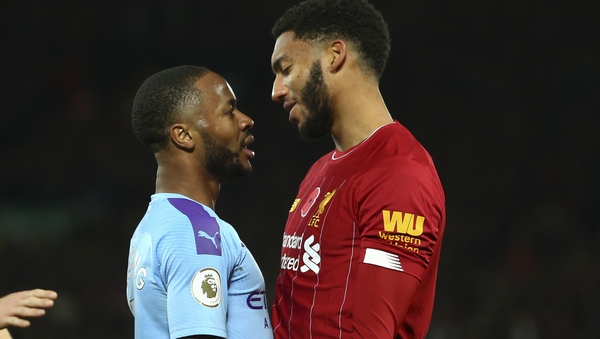Raheem Sterling (L) and Joe Gomez square up to each other at Anfield