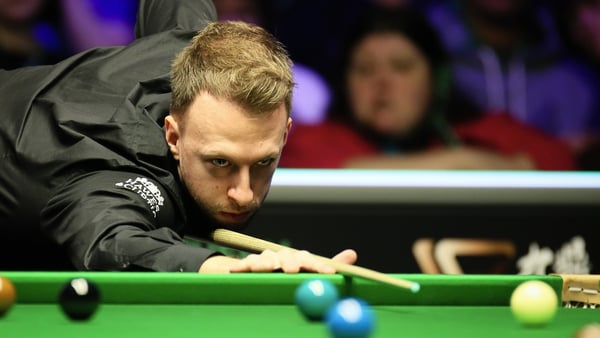 Judd Trump compiled breaks of 85 and 114 on his way to setting up a last 16 clash with Luca Brecel
