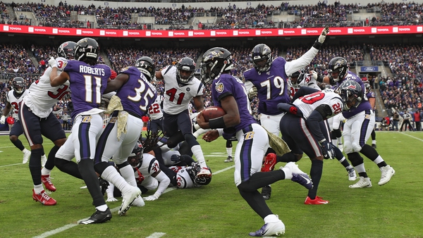 Quarterback Lamar Jackson rushes for the Ravens