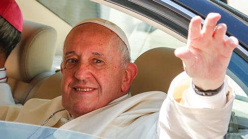 Pope Francis waves to crowds after his arrival in Thailand