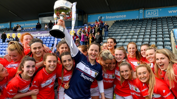 Cork captain Martina O'Brien and her team-mates celebrate with the cup after their league final victory