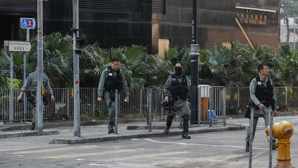 Police patrol an area outside the Hong Kong Polytechnic University