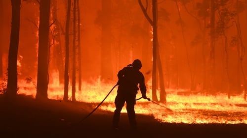 NSW fires: Two volunteer firefighters die after truck rolls