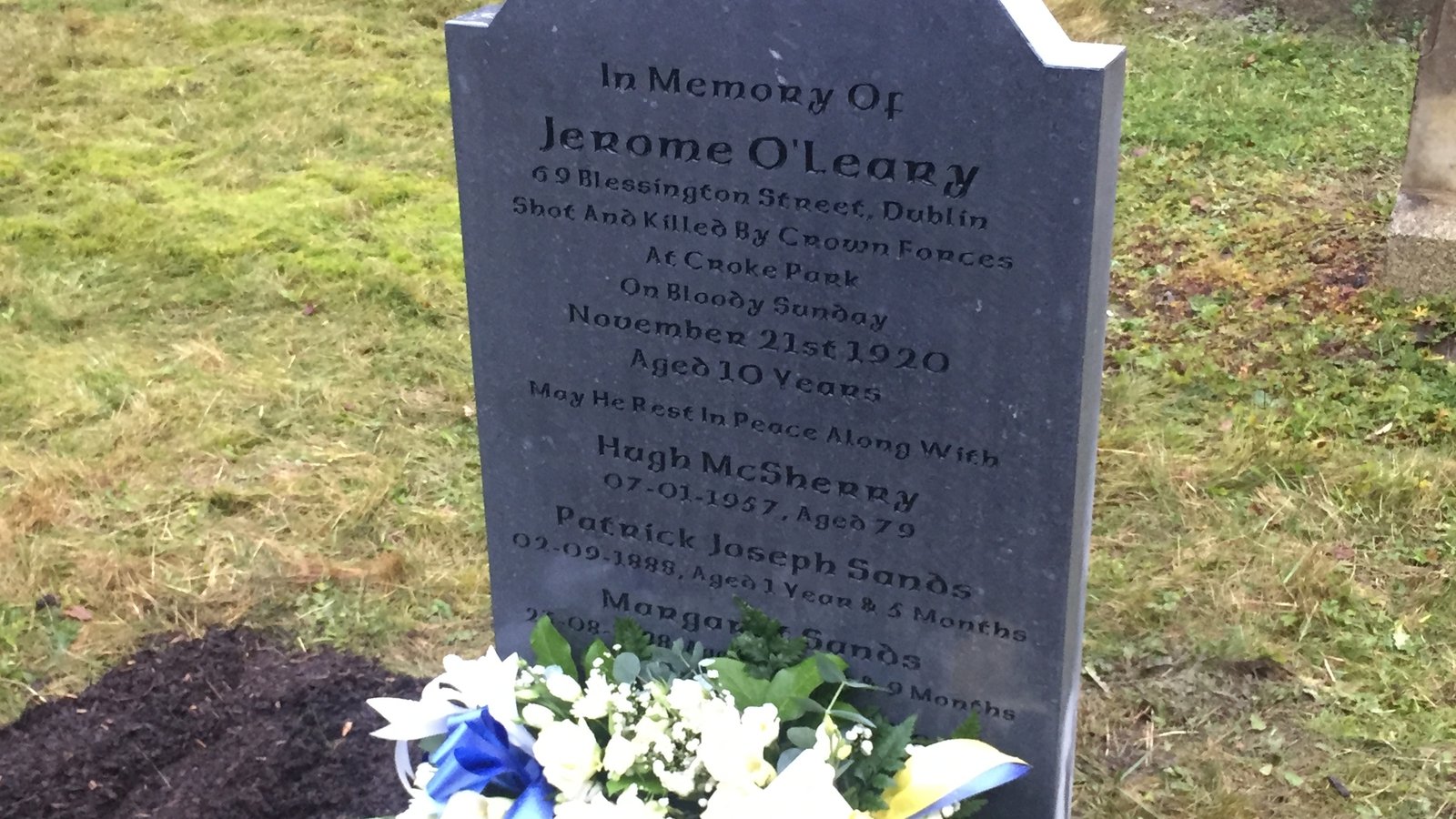Image - The gravestone of 10-year-old Jerome O'Leary, erected in 2019 as part of the GAA's Bloody Sunday Graves Project