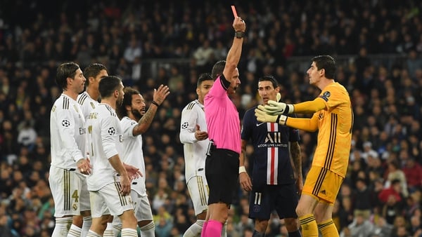 Thibaut Courtois is shown a red card that was later rescinded