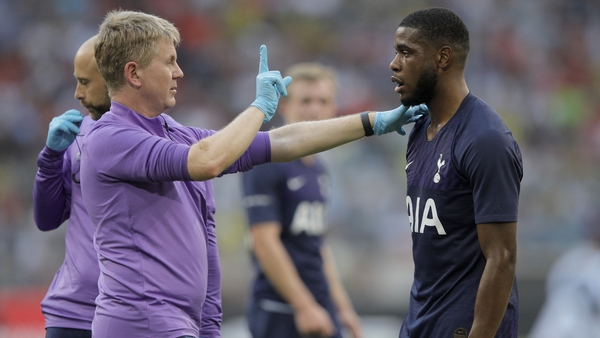 Japhet Manzambi Tanganga of Tottenham is checked for a concussion during the Audi Cup 2019 semi final match between Real Madrid and Tottenham