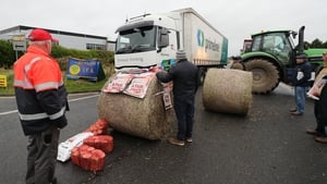 Beef farmers tractors block the entrance and exit to an Aldi Ireland distribution centre in Naas, Co Kildare