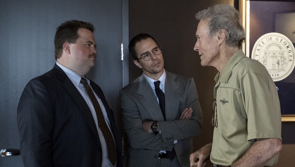 Richard Jewell star Paul Walter Hauser (left) on set with co-star Sam Rockwell and director Clint Eastwood