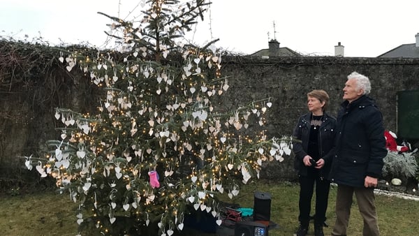 Catherine Corless and survivor Peter Mulryan at the Christmas tree in Tuam