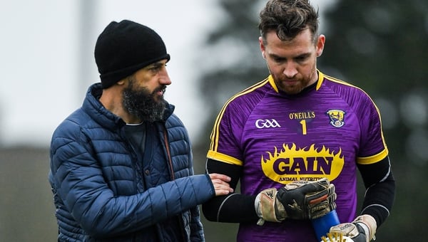 Wexford manager Paul Galvin in conversation with goalkeeper Pat Doyle at half- time