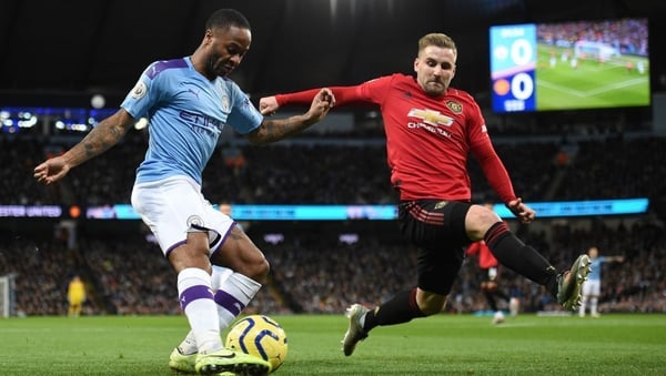 Raheem Sterling comes under pressure from Luke Shaw in the Manchester derby