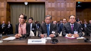 Myanmar's leader Aung San Suu Kyi sits with her delegation at The Hague