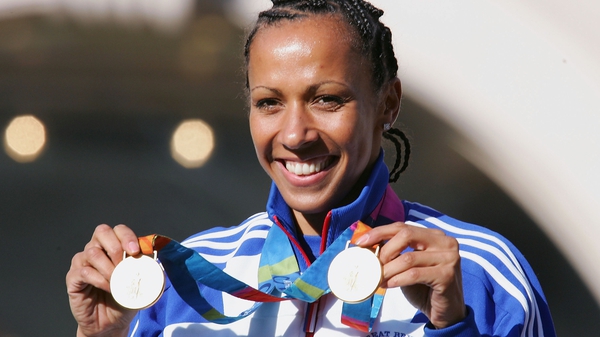 Kelly Holmes shows off her two gold medals back in 2004