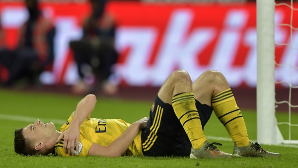 Kieran Tierney winces in pain at the London Stadium