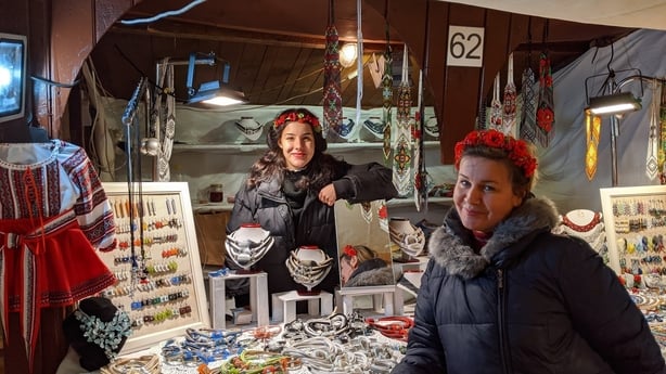 Anastazja (left) and her mother, selling handmade Polish wares from their stall, Galina Kavowska, at Krakow Christmas Market (Jonjo Maudsley/PA)