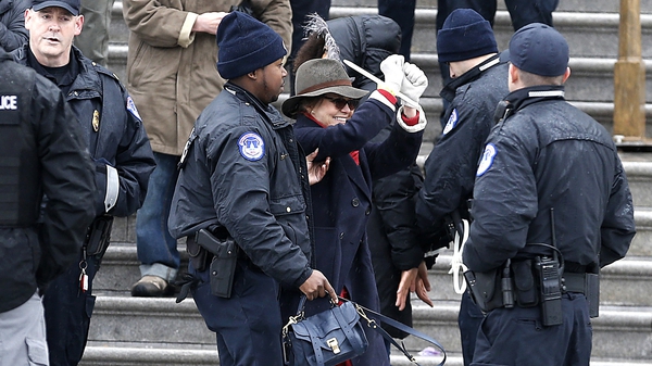 Sally Field being escorted away by police
