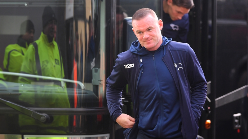 Wayne Rooney departs the coach at Derby County ahead of their game against Millwall