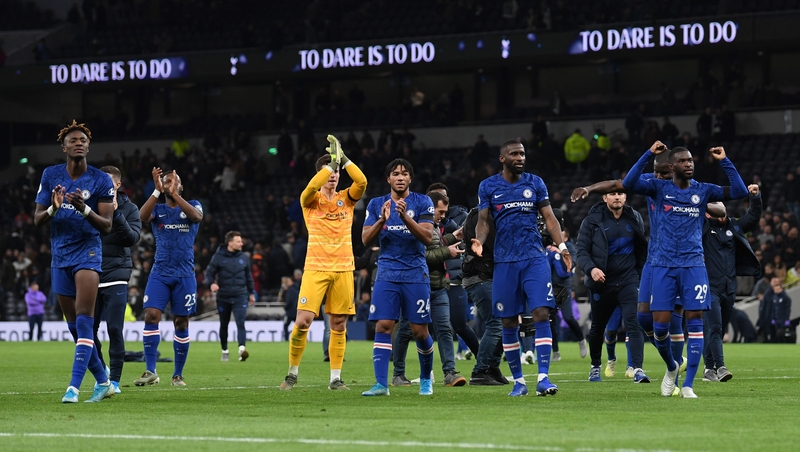 Chelsea players salute their fans after their 2-0 win at Tottenham