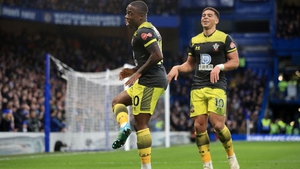 Michael Obafemi celebrates his first-half goal at Stamford Bridge