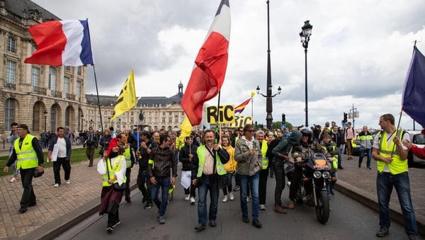 People take part in a demonstration called by the 'yellow vest' (gilets jaunes) movement in May in Bordeaux