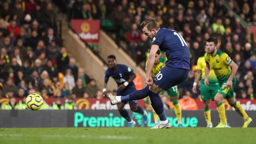 Harry Kane slots home from the penalty spot at Carrow Road