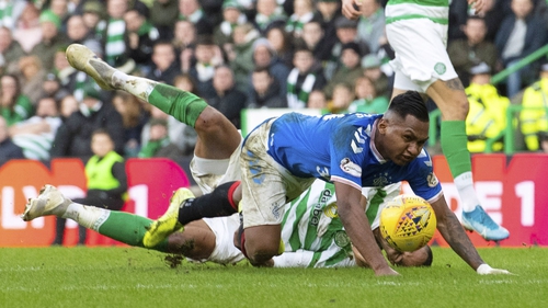 Rangers' Alfredo Morelos goes to ground after a challenge from Celtic's Christopher Jullien