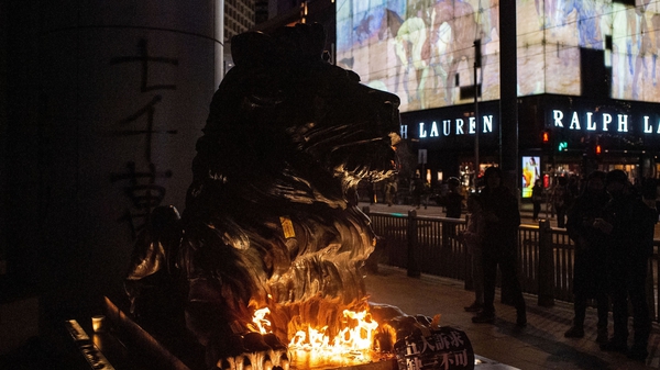 The two lions outside HSBC were set alight after being doused in a flammable liquid