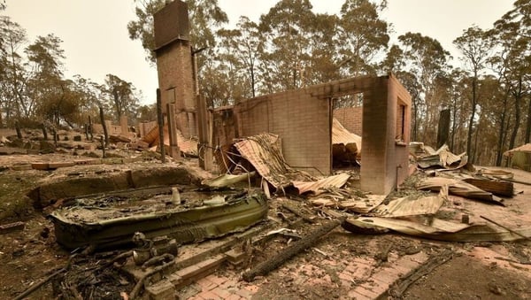 The remains of a house destroyed by a bushfire is seen just outside Batemans Bay in New South Wales today