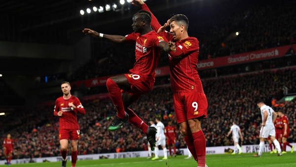 Liverpool's Sadio Mane (L) celebrates his goal with Roberto Firmino
