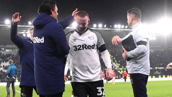 Wayne Rooney gets a pat on the head for a job well done