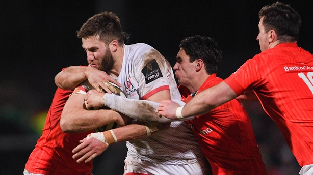 Ulster's Stuart McCloskey is tackled by Munster's Sammy Arnold (left) and Joey Carbery