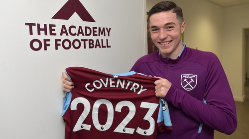 Conor Coventry poses with a celebratory jersey at the West Ham academy
