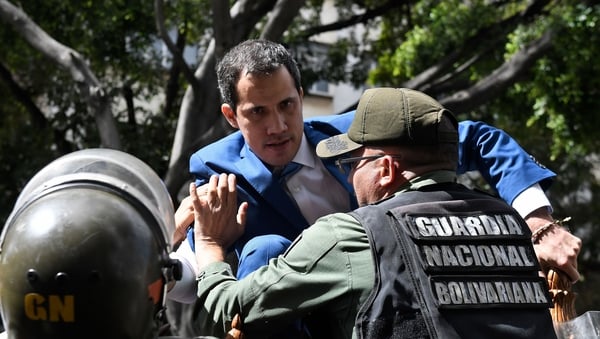 Venezuelan opposition leader and self-proclaimed acting president Juan Guaido is prevented from reaching the National Assembly building in Caracas