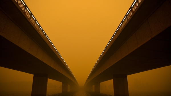 Commonwealth Avenue bridge is seen surrounded by smoke haze at Lake Burley Griffin in Canberra, Australia