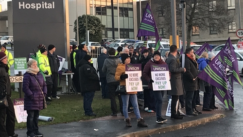 Health workers staging a strike outside Ulster Hospital