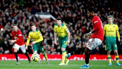 Marcus Rashford slots home his second from the spot