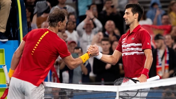 Rafael Nadal and Novak Djokovic of Serbia shake hands following their singles match