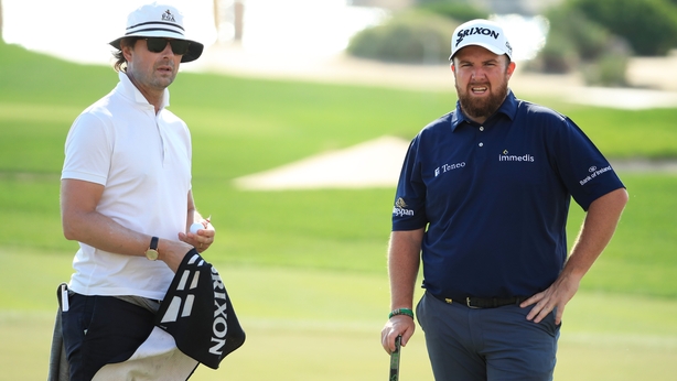 Shane Lowry of Ireland and his coach Neil Manchip look on during the Pro-Am ahead of the Abu Dhabi HSBC Championship